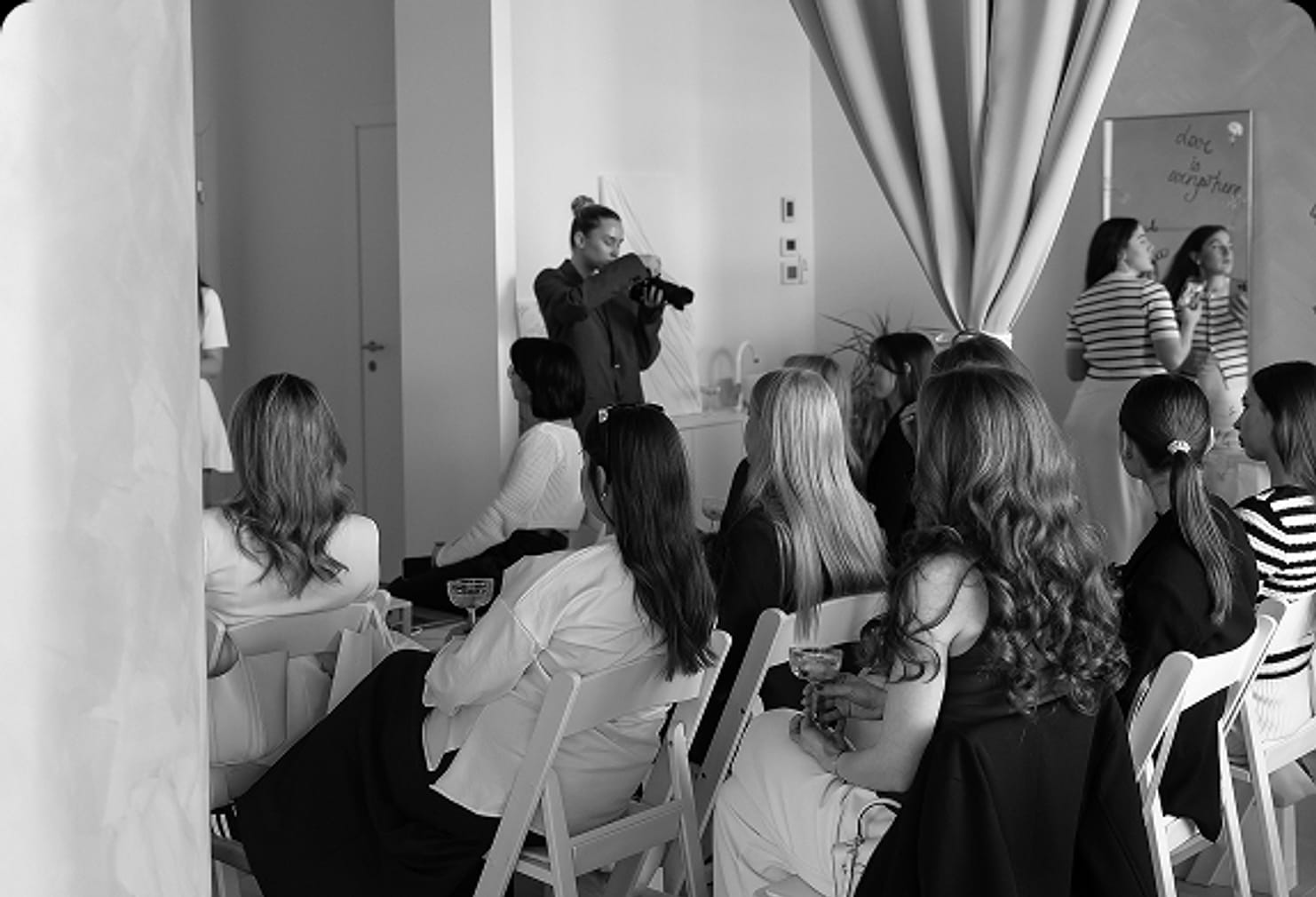 An audience seated for a beauty masterclass